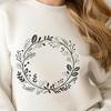 A hand-drawn floral wreath design created in vector format for digital use.