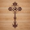 Ornate Floral Cross Design Ornate cross with floral elements in a traditional crucifix design.