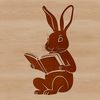 A cartoon-style rabbit sitting on the ground with a book in its front paws.