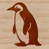 Flightless Bird Silhouette A small, flightless bird with black and white feathers, standing on a rocky shoreline.