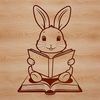Bunny Bookworm Silhouette An anthropomorphic rabbit sitting on the ground with a book in its paws.