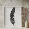 Beautiful Feather SVG Icon for Crafting A single white feather with delicate curves and pointed tip, suitable for vector art designs.