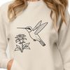 Colorful Bird Illustration with Flowers A vector design of a colorful hummingbird surrounded by ornate flowers and foliage.