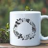 Whimsical Wreath Design SVG File A floral SVG wreath design featuring intertwined flowers and foliage.