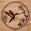 Floral bird clip art design A colorful illustration of a hummingbird perched on a flower, showcasing its intricate details.