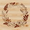 A circular floral arrangement made up of interlocking flowers and foliage.