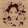 Floral Female Silhouette Vector Art A vector illustration of a smiling female figure surrounded by floral elements.