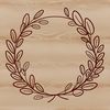 A floral design in the form of a circular wreath made up of interconnected elements.