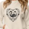 A vibrant flamingo standing in shallow water, adorned with ornate love hearts.