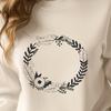 Free Vector Art Flower Garland A floral design made up of intertwined elements forming a circular shape.