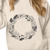 Free SVG Wreath Clipart Template A floral wreath design suitable for vector art projects, including Cricut and laser cutter templates.