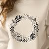 Free SVG Wreath Pattern for Crafting A floral wreath design made from interlocking leaves and flowers in a circular pattern.