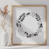 Circular Wreath Vector Artwork A floral design featuring a circular wreath shape with intricate details.