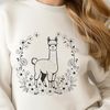 A high-quality vector illustration of a South American alpaca standing in a field with floral elements.