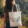 Delicate Angel Wing Illustration A pair of stylized angel wings with a subtle halo effect, suitable for vector design projects in Illustrator or Procreate.