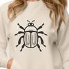 A colorful illustration of a cute beetle insect with a smiling face.