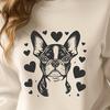 A cute Boston Terrier breed dog with heart symbols around its head.