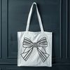 Beautiful Gift Wrap Accents A colorful ribbon bow with tied ends, ideal for gift wrapping or decorating.