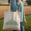 A detailed digital illustration of a city skyline at sunset, suitable for use in graphic design and cutting machine projects.
