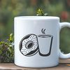 Donut in Your Coffee Cup A circular food dessert on top of a coffee cup.