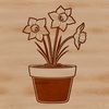 Daffodil Stem in Ceramics A single stem of a bright yellow daffodil emerging from a green ceramic flower pot.