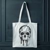 A graphic illustration of a dripping skull in a gothic style.