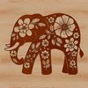 A standing elephant with ornate floral patterns surrounding its body.