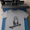 Cute Ferret on Skateboard Silhouette A silhouette illustration of a curious ferret standing on its hind legs with front paws gripping a skateboard.