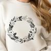 Free SVG Wreath Artwork Download A circular floral arrangement with intertwined elements, suitable for digital and physical applications.