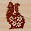 A small, agile Shetland sheepdog breed sitting on a floral patterned background.