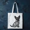 Floral Background Dog Breed Image A sitting Welsh Corgi breed dog with a floral patterned background.