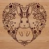 Floral Rabbit Love A cartoon rabbit sitting in a floral setting with love hearts surrounding it.