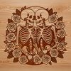 Embracing Boneyard Bouquet A pair of skeletons embracing, surrounded by a floral garland with roses and other flowers.