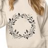 A floral design featuring a circular wreath with intricate details, suitable for vector art projects.