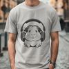 Cute Guinea Pig Silhouette with Headphones SVG illustration of a cute guinea pig wearing headphones.