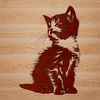 Whimsical Gray Kitten Silhouette A cute gray kitten sitting on its haunches with front paws folded under its body.