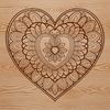 A colorful mandala heart design made from intricate patterns and shapes.