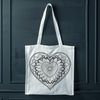 Beautiful Heart Design with Symmetrical Patterns A intricate design featuring a heart-shaped mandala with symmetrical patterns and lines.