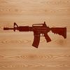 A detailed illustration of an assault rifle with various components labeled.