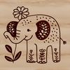 A standing elephant in a floral savannah landscape.