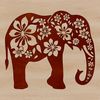 A standing elephant with intricate ornate floral patterns.