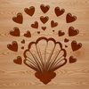 A decorative seashell with intricate details and love hearts incorporated into the design.