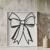 Simple Red Ribbon Decoration A simple red ribbon bow with rounded ends, suitable for various occasions including Christmas and birthdays.