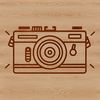 A digital camera icon made up of clean lines and minimalist design.