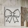 Center Knot Embellished Bow A decorative bow made from ribbon and embellished with a center knot.