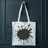 A stylized splat shape with rounded edges and a messy texture.