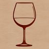 A wine poured into a glass on a table.