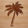 A lone palm tree standing tall on a sandy beach, surrounded by tropical foliage.