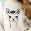 Friendly South American Camelid A single alpaca standing on a grassy field with a simple background.