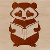 A badger sitting on the ground with a book in its paws.